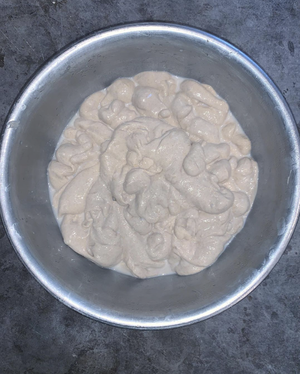 metal bowl filld with very wet bread dough