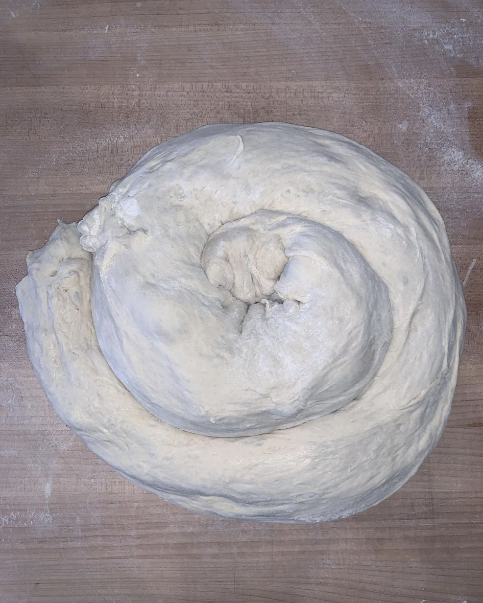 a cord of bread dough shaped into a spiral